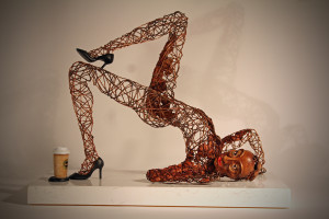 Sculpture of a human figure made with wires
